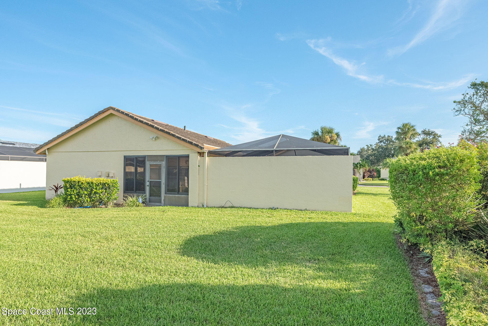 440 Maple Bluff Circle Melbourne, FL 32940 - Photo 89 of 92 a view of a house with a yard and garage