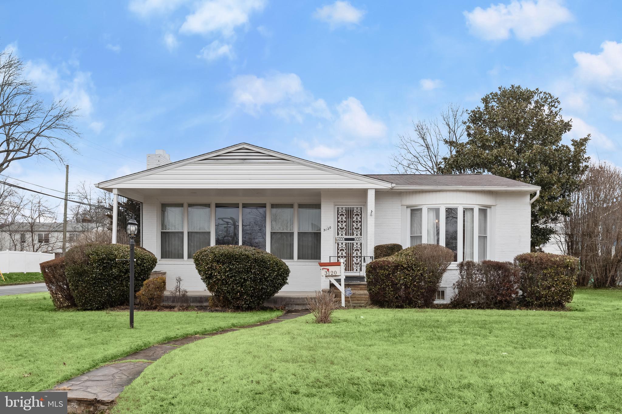 3120 Marnat Road Pikesville, MD 21208 - Photo 1 of 42 a view of a house with a garden and plants
