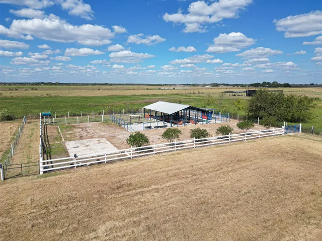 a view of a terrace with a bench and yard