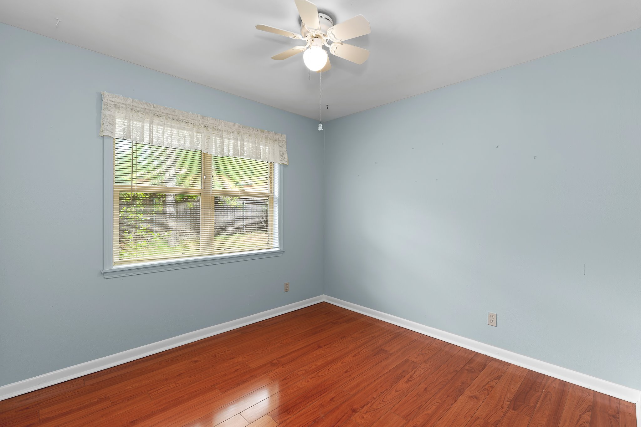 5600 Libyan Circle Austin, TX 78745 - Photo 26 of 37 Unfurnished room with dark wood finished floors and ceiling fan