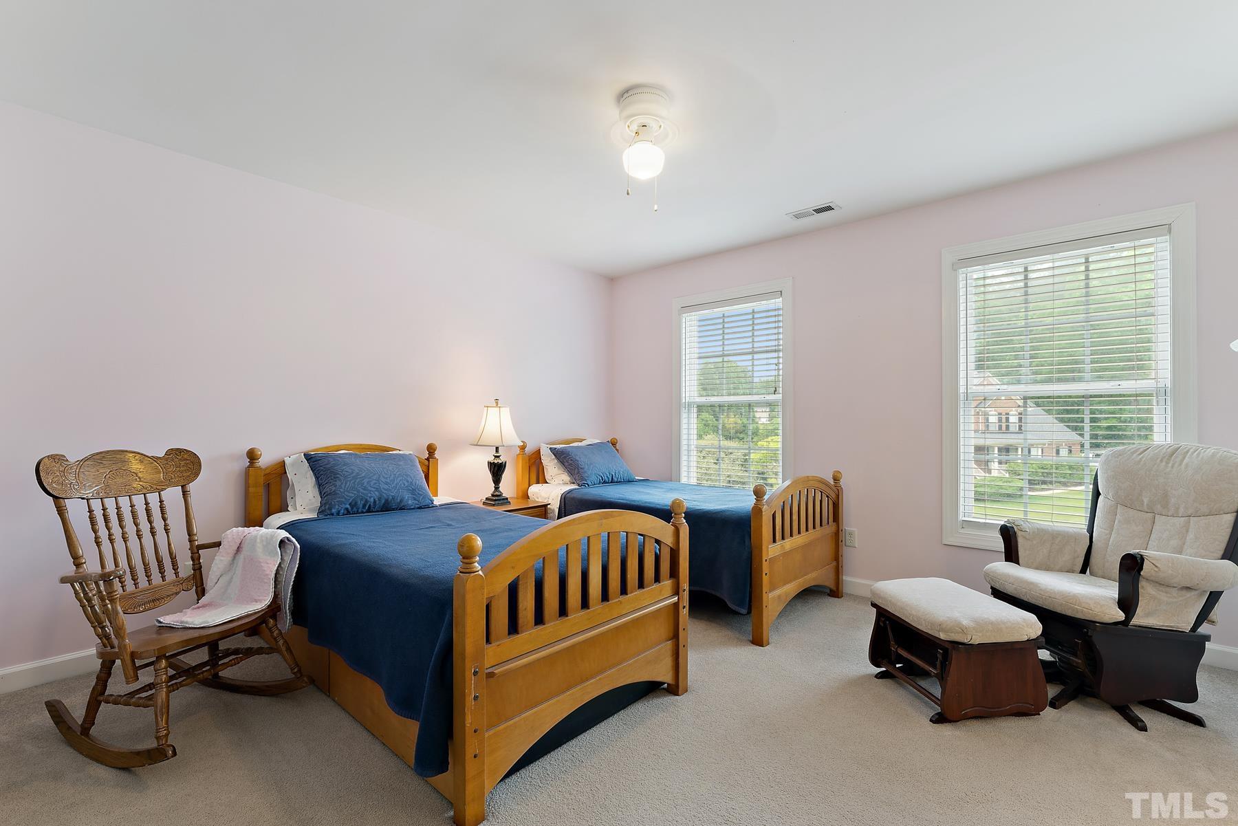 1615 Wood Spring Court Raleigh, NC 27614 - Photo 19 of 27 a bedroom with furniture and windows