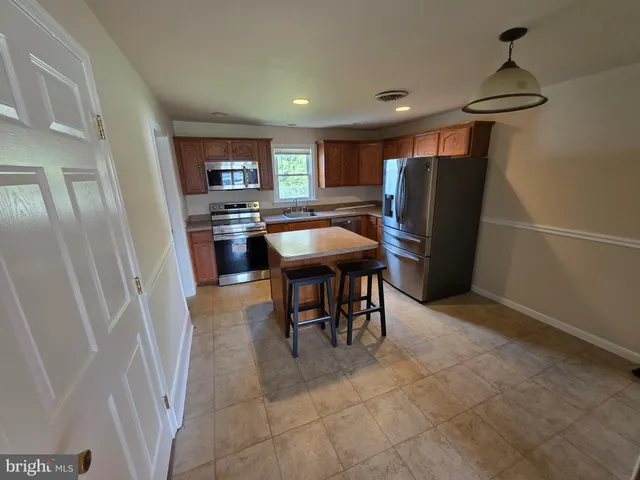 an empty room with windows and entrance