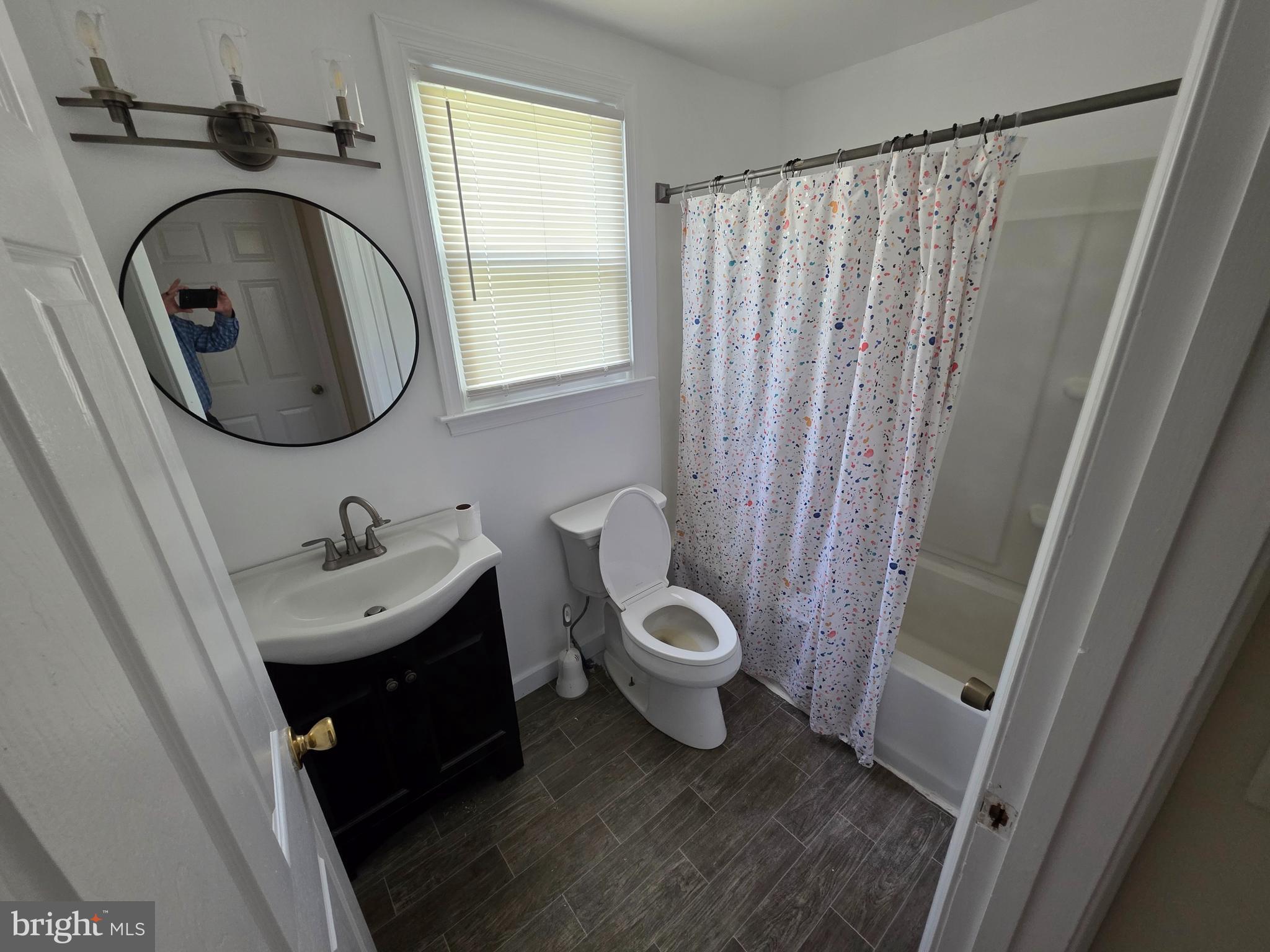 2318 Forrest Avenue Dover, DE 19904 - Photo 8 of 12 a bathroom with a toilet and a sink