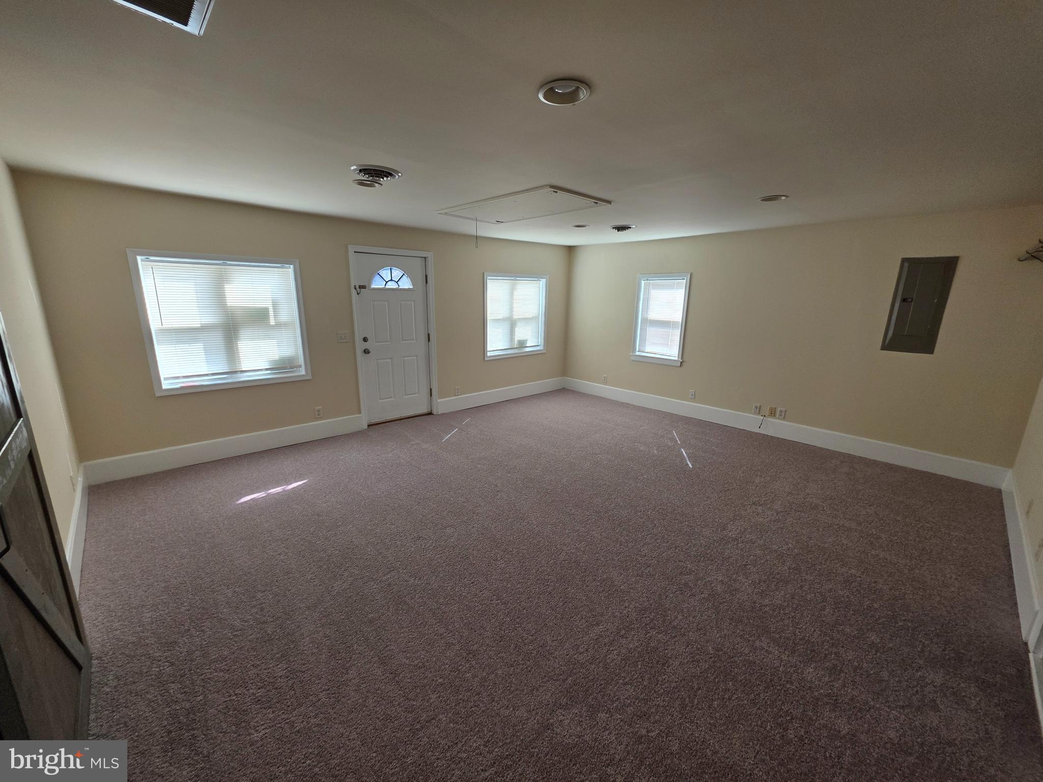 2318 Forrest Avenue Dover, DE 19904 - Photo 10 of 12 an empty room with windows and entrance