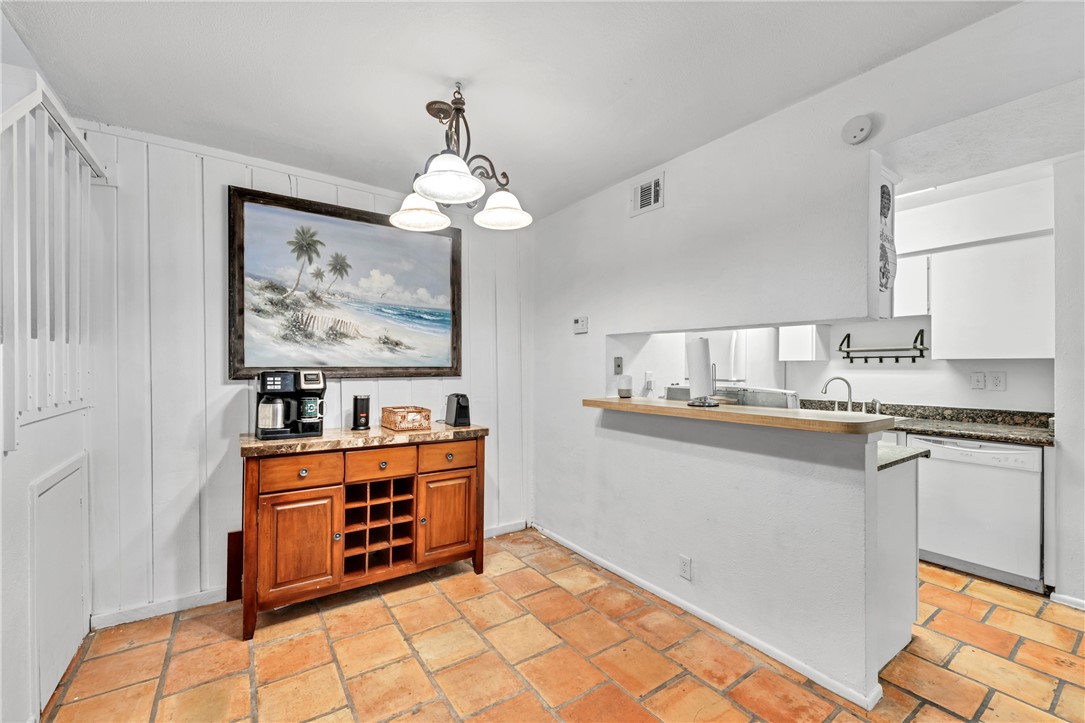 2056 Hidden Lake Corpus Christi, TX 78412 - Photo 11 of 26 a kitchen with stainless steel appliances granite countertop a stove a sink and a refrigerator