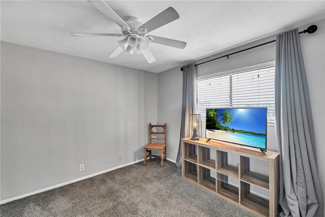 2056 Hidden Lake Corpus Christi, TX 78412 - Photo 15 of 26 a living room with furniture and a flat screen tv