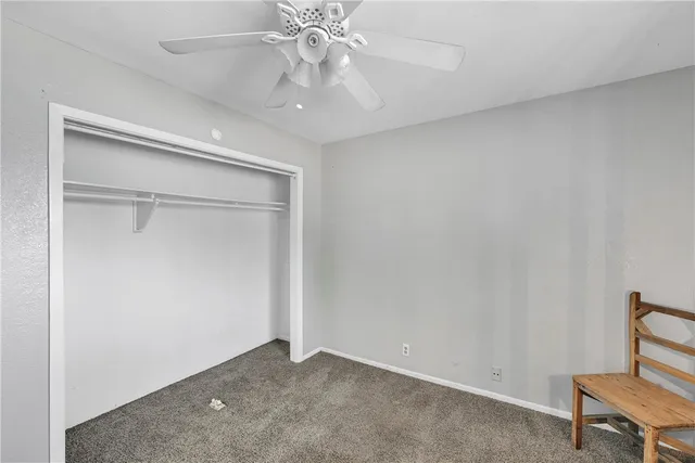 a view of a livingroom with furniture and windows