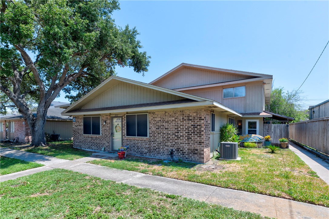 2056 Hidden Lake Corpus Christi, TX 78412 - Photo 2 of 26 a front view of a house with garden