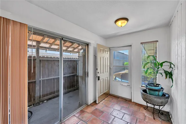 a view of a livingroom with furniture and a potted plant