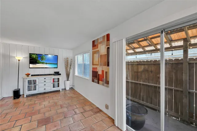 a view of living room with furniture and flat screen tv