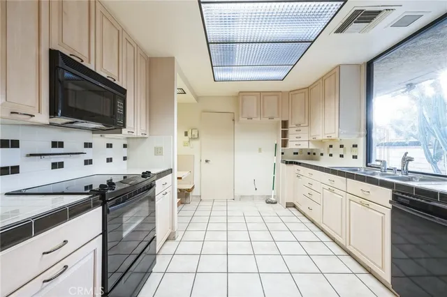 a kitchen with a sink and a window