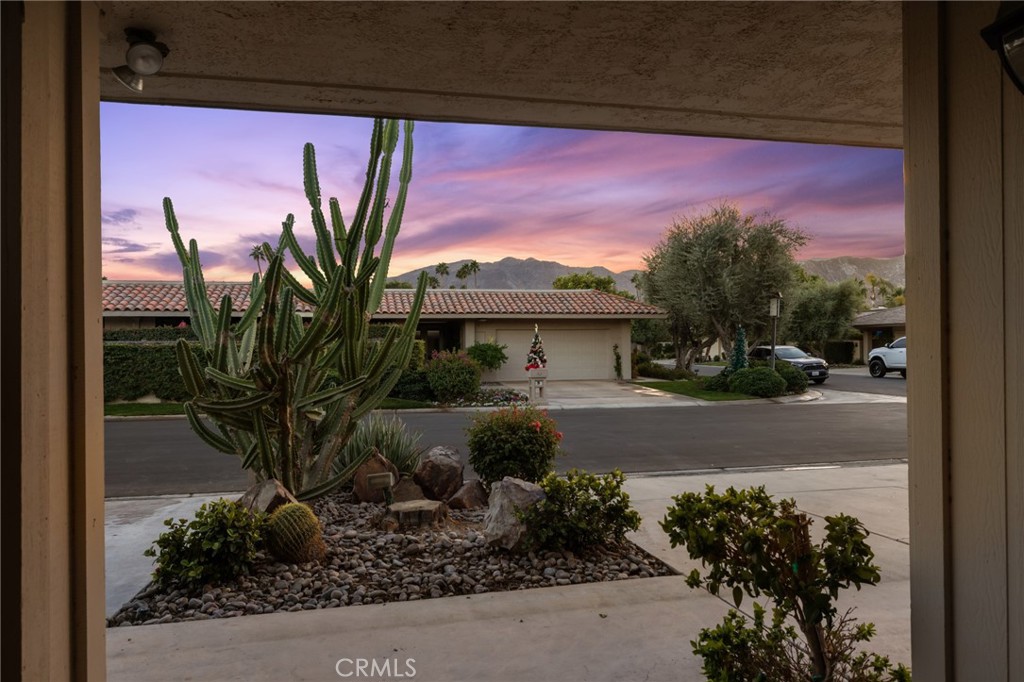 1 Radcliff Court Rancho Mirage, CA 92270 - Photo 22 of 52 a front view of a house with a yard and garage
