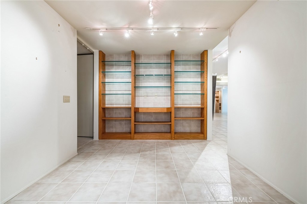 1 Radcliff Court Rancho Mirage, CA 92270 - Photo 36 of 52 a view of walk in closet with empty racks