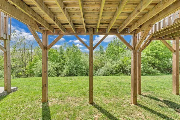a view of a balcony with wooden floor