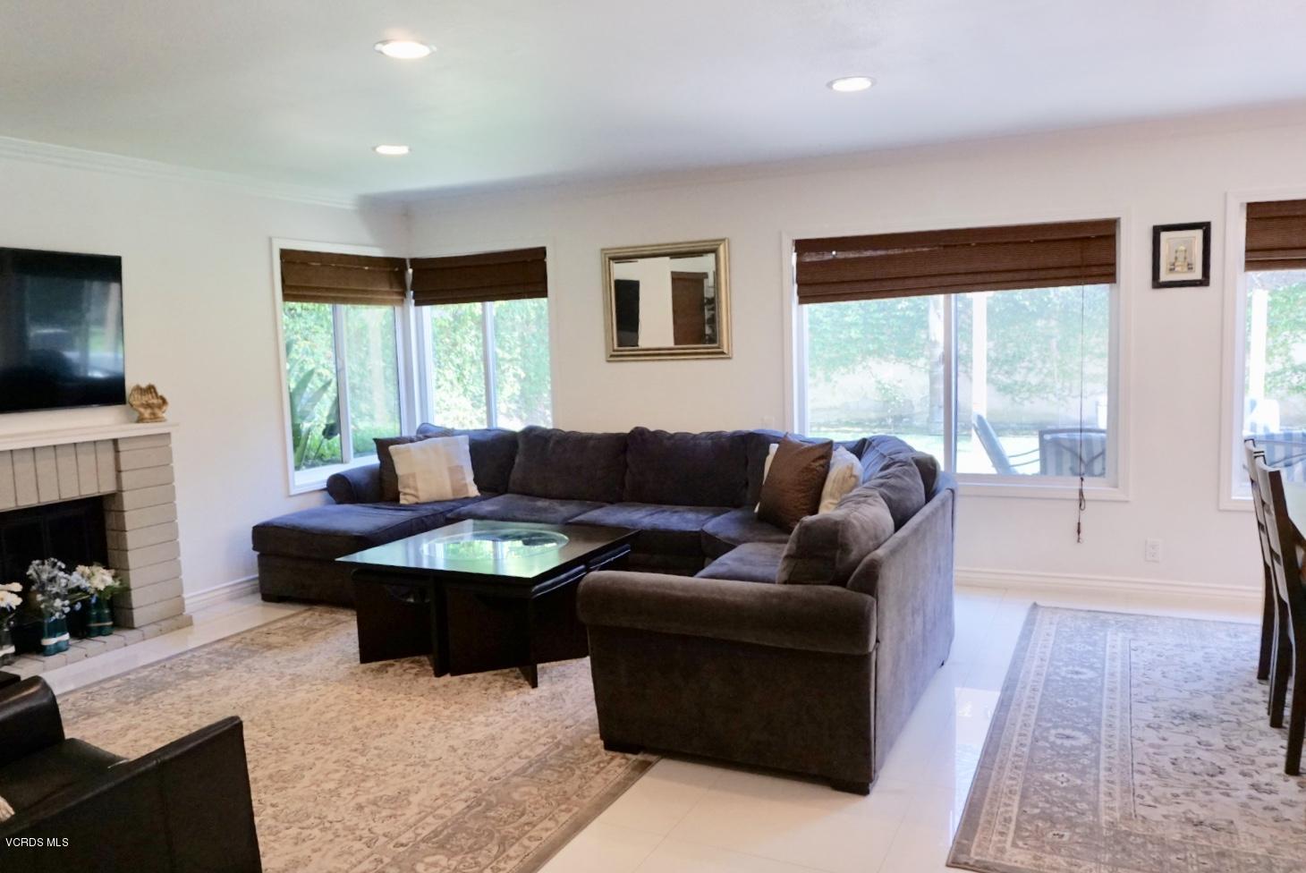 12448 Spring Creek Road Moorpark, CA 93021 - Photo 13 of 19 a living room with furniture and a fireplace