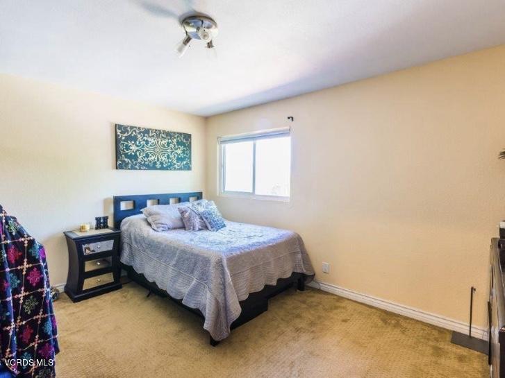 12448 Spring Creek Road Moorpark, CA 93021 - Photo 18 of 19 a bedroom with a bed dresser and a window