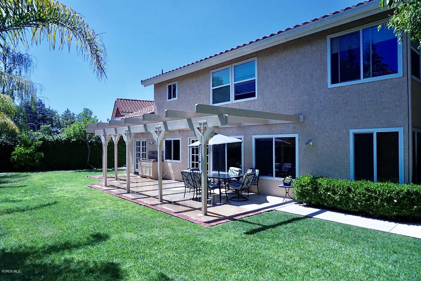 12448 Spring Creek Road Moorpark, CA 93021 - Photo 19 of 19 a view of a house with backyard porch and sitting area
