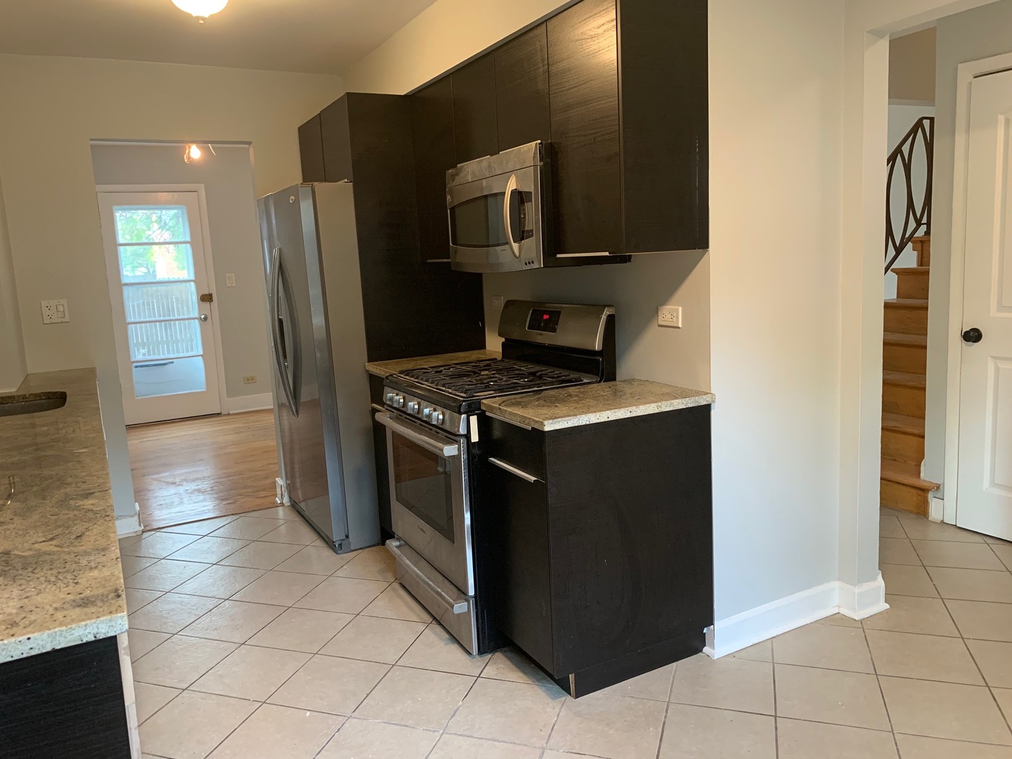 811 Hibbard Road, Unit C Wilmette, IL 60091 - Photo 3 of 19 a kitchen with stainless steel appliances granite countertop a refrigerator and a stove