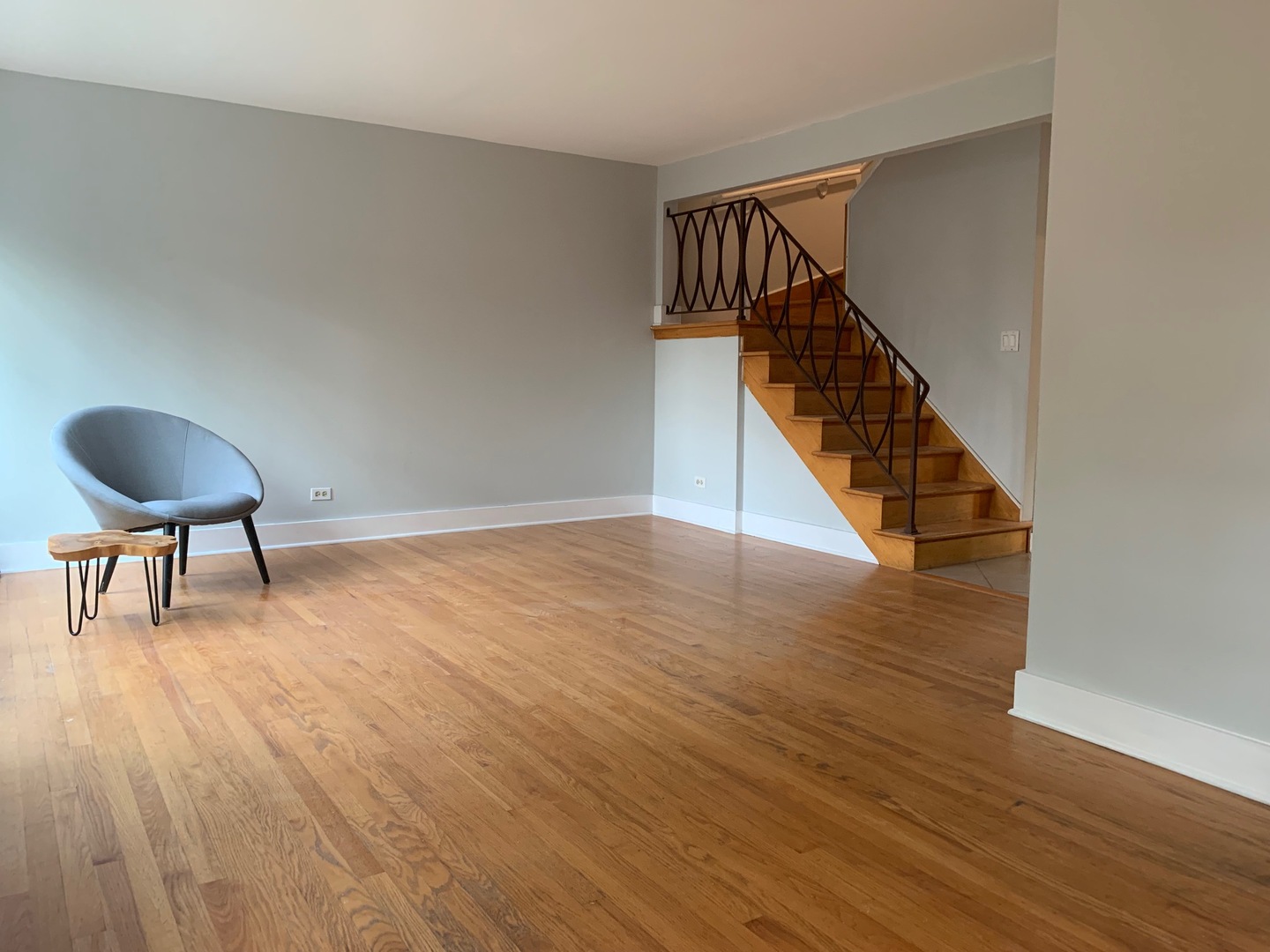 811 Hibbard Road, Unit C Wilmette, IL 60091 - Photo 5 of 19 a view of a hallway with wooden floor and stairs