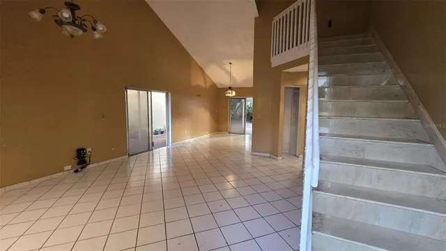 a bathroom with a granite countertop sink a mirror and a shower