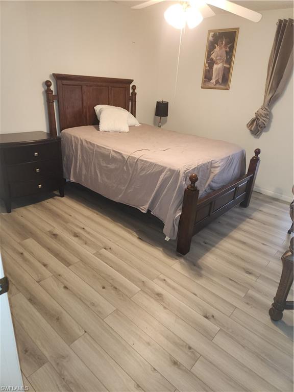 30 Watercolor Way, Unit 30 Naples, FL 34113 - Photo 7 of 9 Bedroom with light wood-style flooring