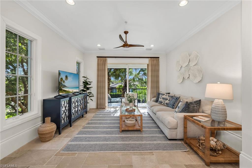 2323 Tradition Way, Unit 201 Naples, FL 34105 - Photo 5 of 48 Family room sits off the kitchen, with impact sliding glass doors that open out to the wraparound lanai...