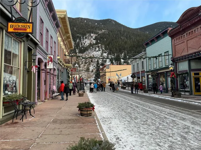 a view of a street with cars