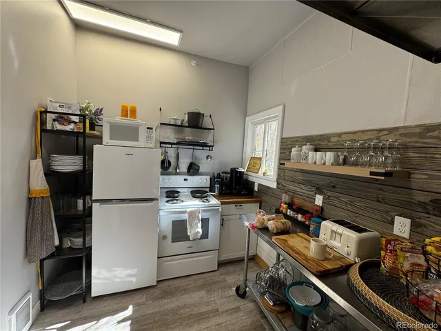 a storage room with washer and dryer