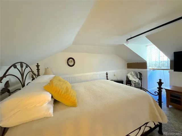 a bathroom with a sink mirror toilet and shower