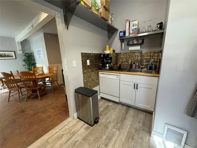 a kitchen with stainless steel appliances granite countertop a sink and cabinets