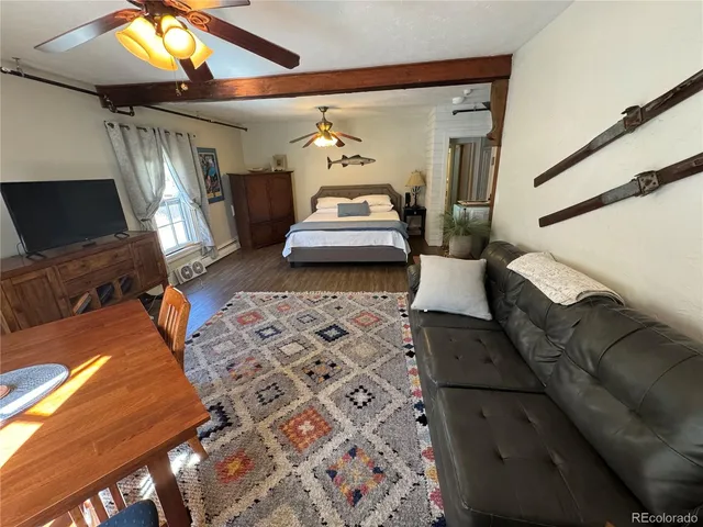 a bedroom with a bed next to a window with the outer view