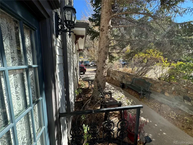 a backyard of a house with table and chairs