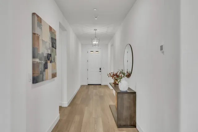 a living room with a fireplace and a flat screen tv