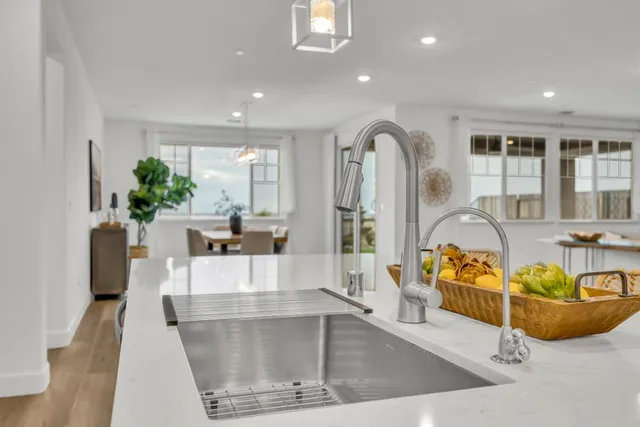 a view of a house with a backyard porch and sitting area