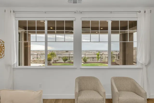 a view of a swimming pool and an outdoor seating