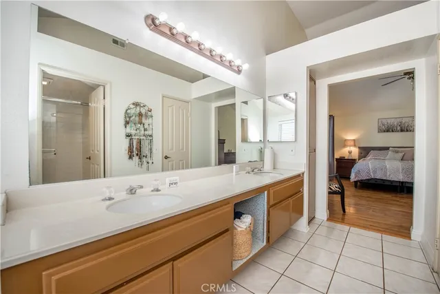 a en suite bathroom with a sink and a mirror