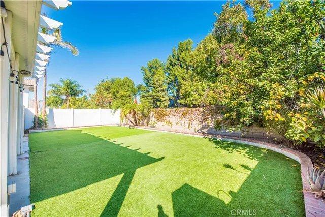 a view of a swimming pool with a yard