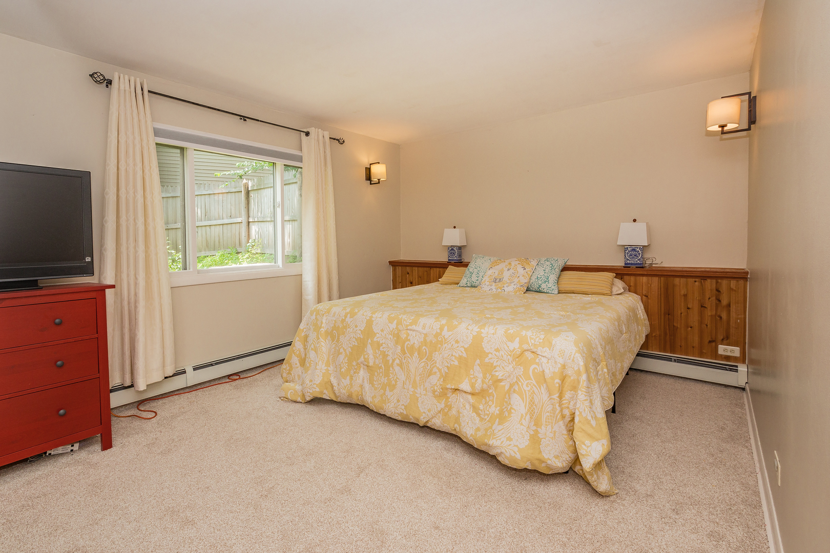 1440 Banbury Road Mundelein, IL 60060 - Photo 14 of 28 a bedroom with a bed and flat screen tv