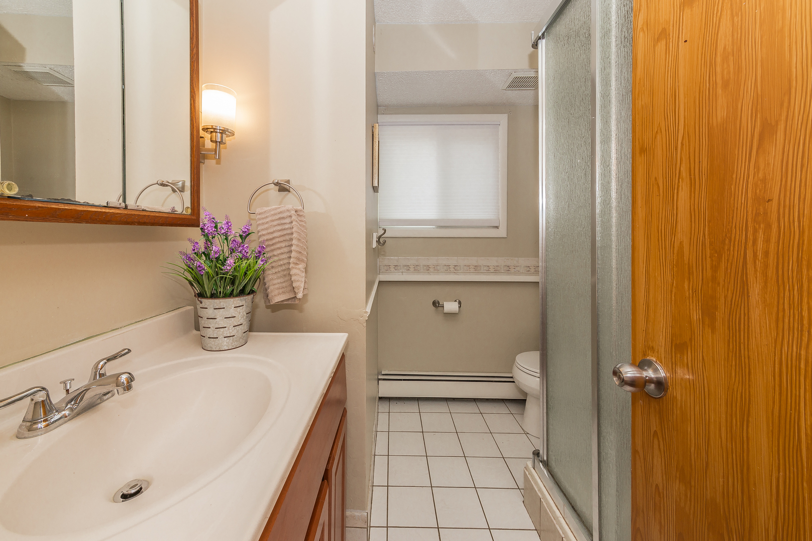 1440 Banbury Road Mundelein, IL 60060 - Photo 16 of 28 a bathroom with a sink a toilet and shower
