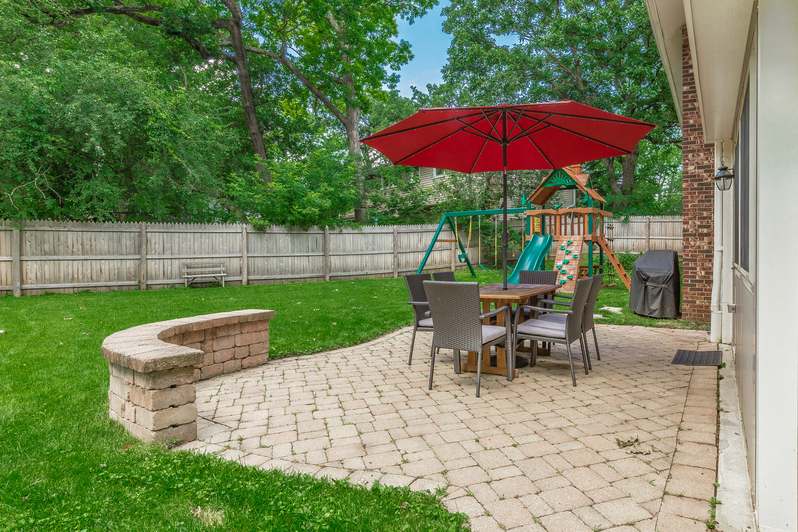 1440 Banbury Road Mundelein, IL 60060 - Photo 22 of 28 a view of a chairs and table under an umbrella