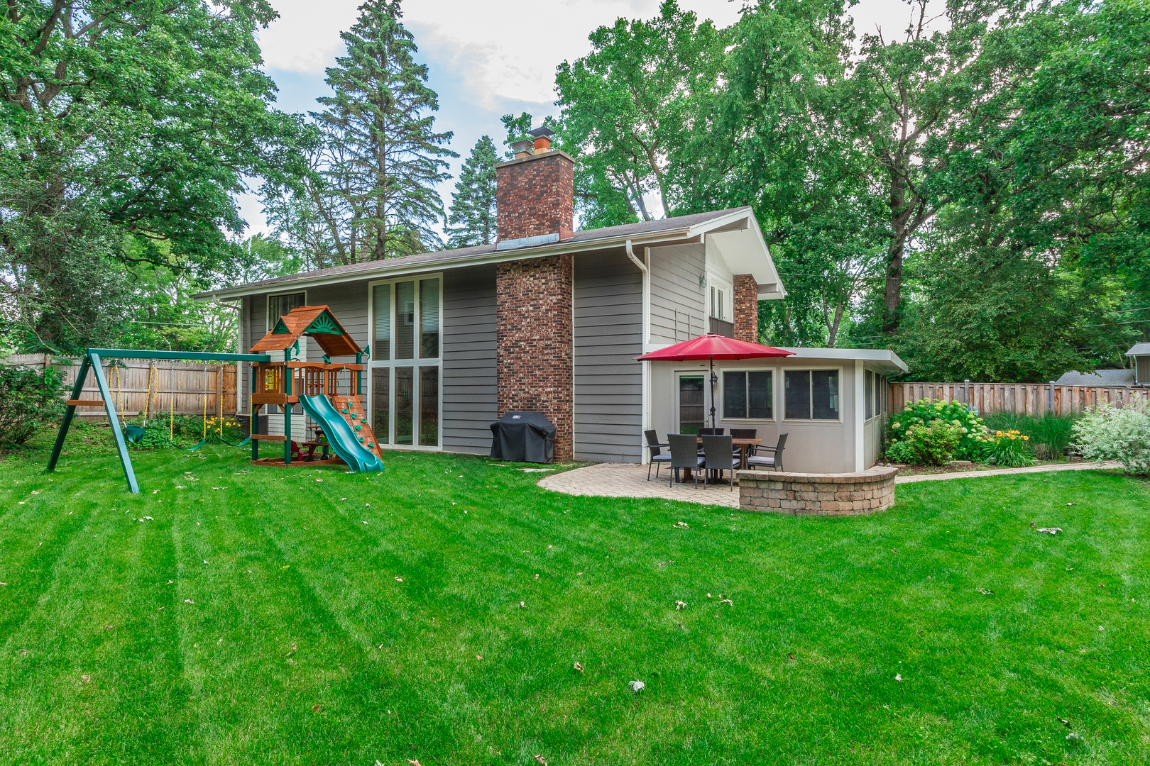 1440 Banbury Road Mundelein, IL 60060 - Photo 28 of 28 a view of a house with backyard and a patio