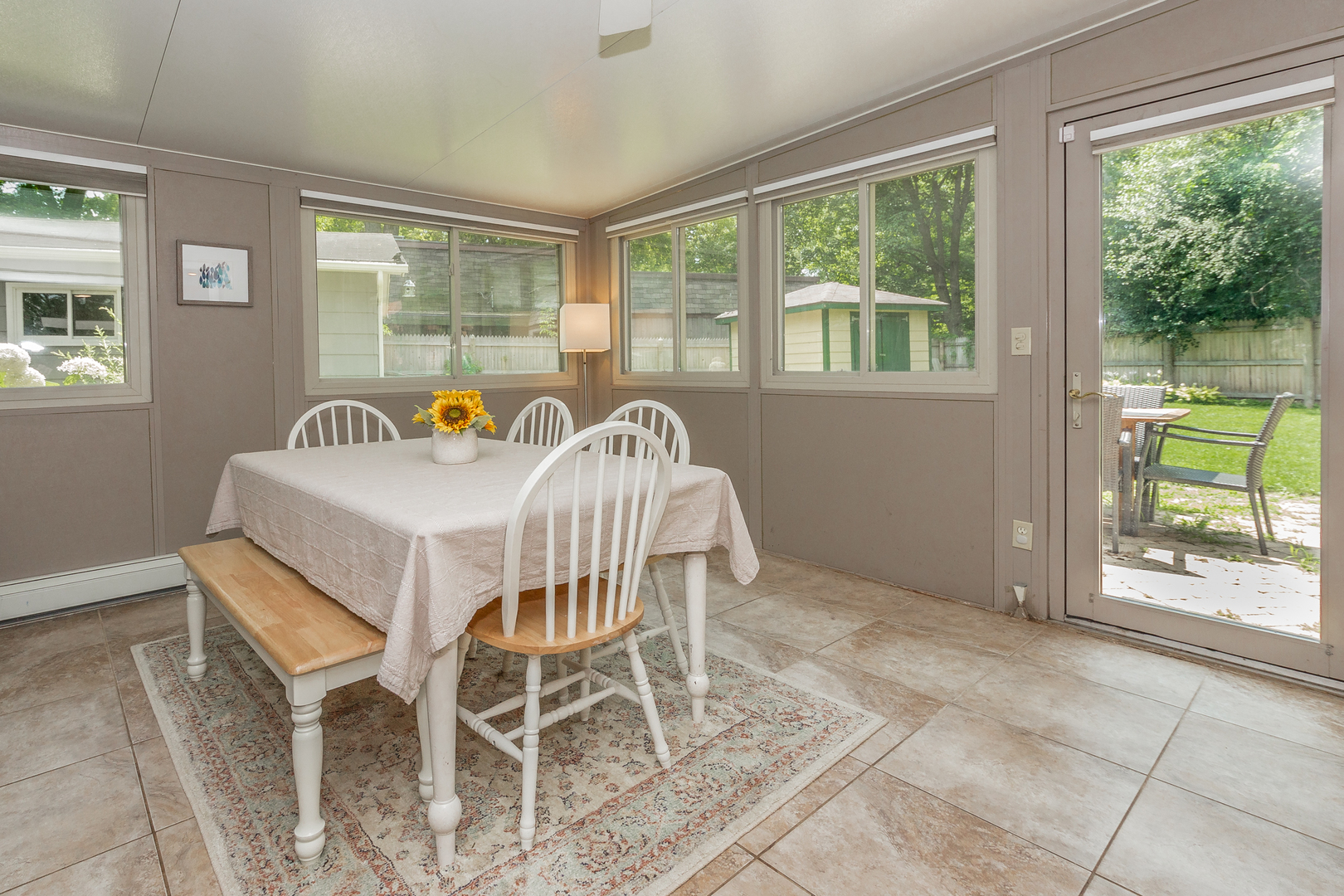 1440 Banbury Road Mundelein, IL 60060 - Photo 9 of 28 a dining room with furniture and a floor to ceiling window
