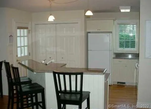 a view of kitchen with furniture and window