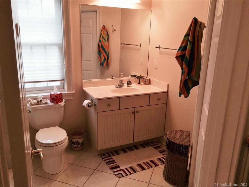 57 Harbor Avenue Madison, CT 06443 - Photo 10 of 16 a bathroom with a sink toilet and shower