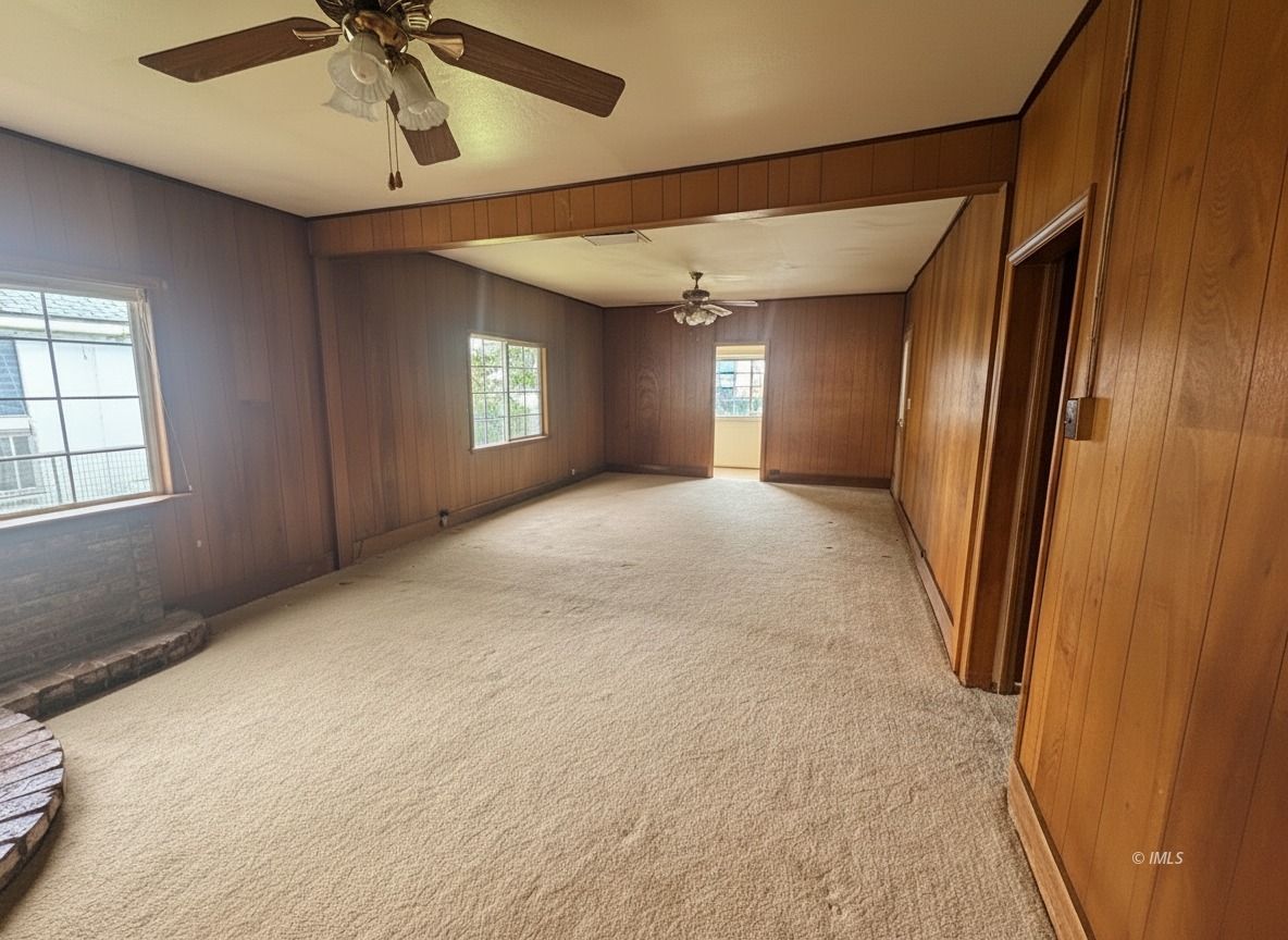 411 East Line Street Bishop, CA 93514 - Photo 6 of 12 a view of a livingroom with a ceiling fan and window