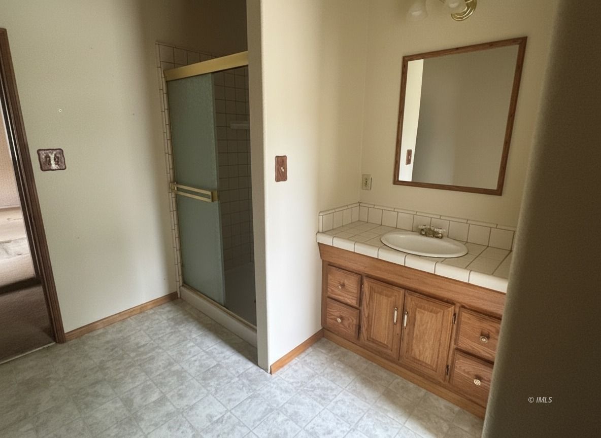 411 East Line Street Bishop, CA 93514 - Photo 7 of 12 a bathroom with a sink and a mirror