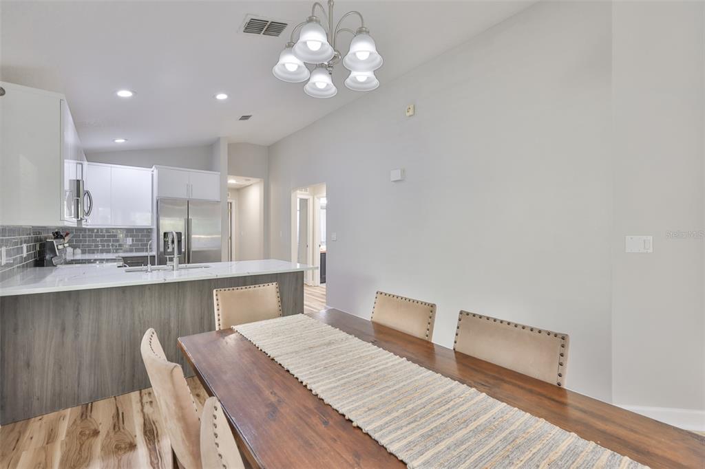 2331 West Chestnut Street Tampa, FL 33607 - Photo 11 of 34 a kitchen with a table and chairs in it