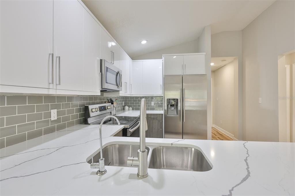 2331 West Chestnut Street Tampa, FL 33607 - Photo 14 of 34 a view of a kitchen with a sink and dishwasher