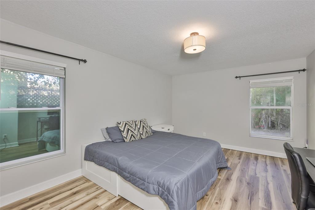 2331 West Chestnut Street Tampa, FL 33607 - Photo 16 of 34 a bedroom with a bed and a window