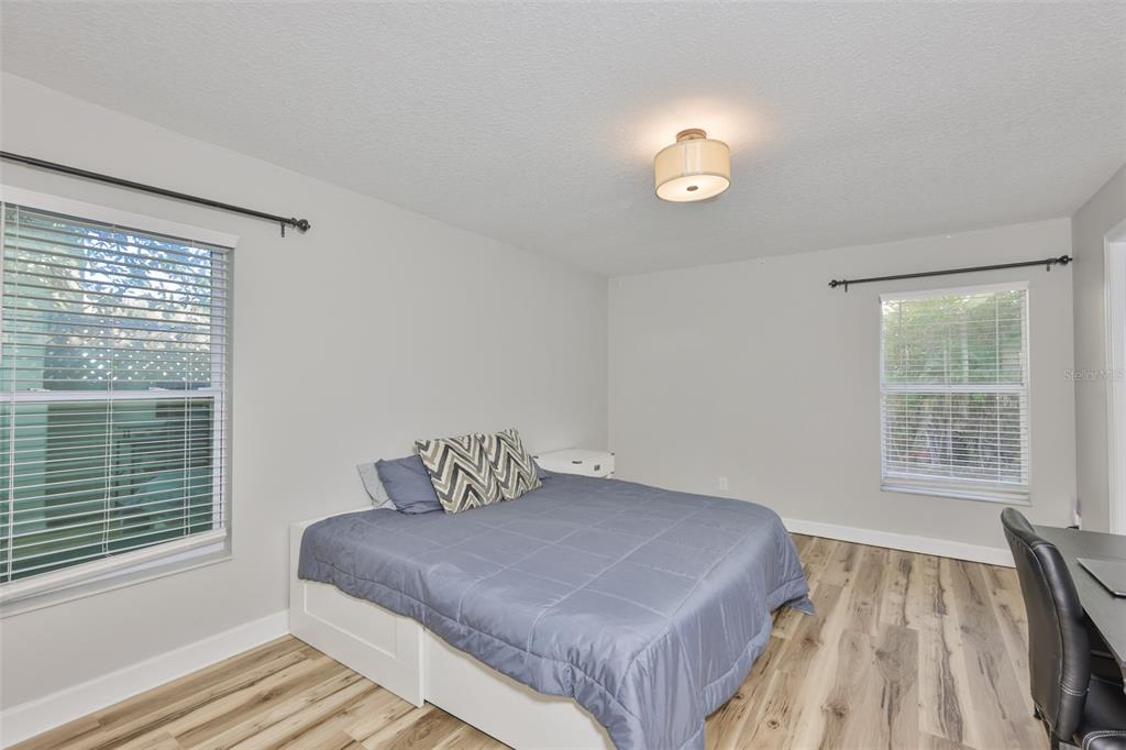 2331 West Chestnut Street Tampa, FL 33607 - Photo 17 of 34 a bedroom with a bed and a window